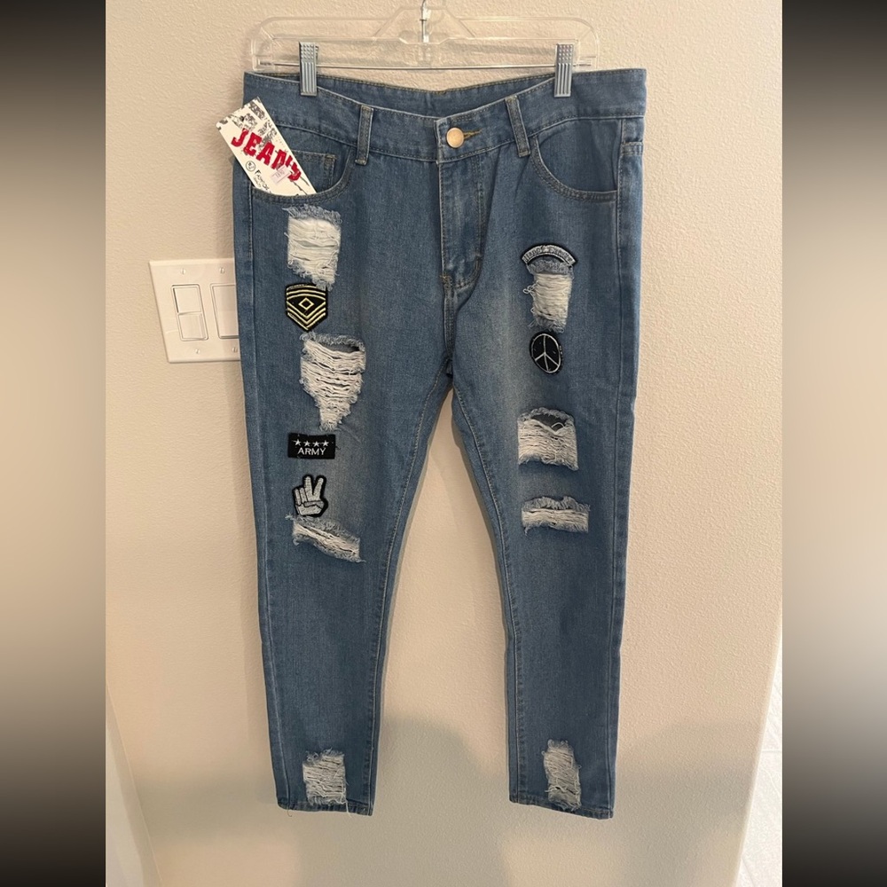Blue Distressed Jeans with Rips and Decorative Patches